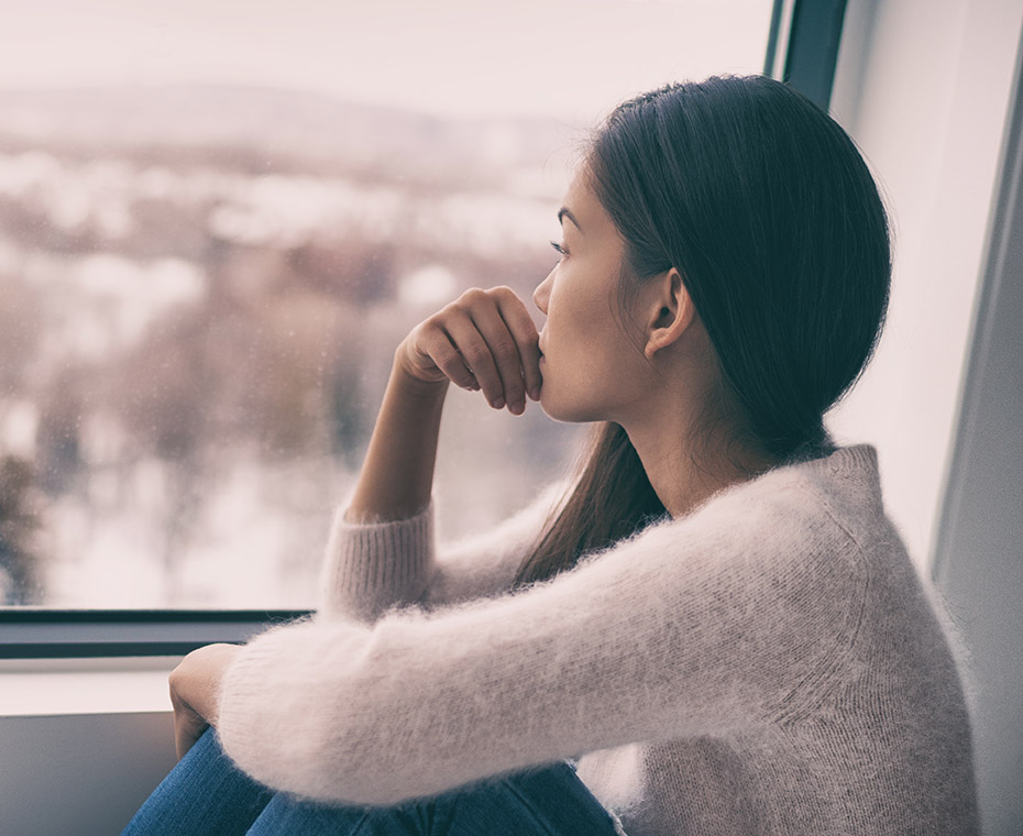 Woman sitting at the window